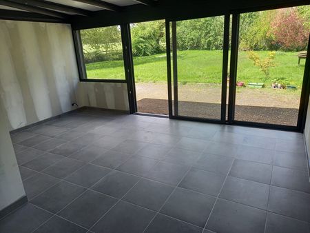 Pose d'un carrelage dans une véranda